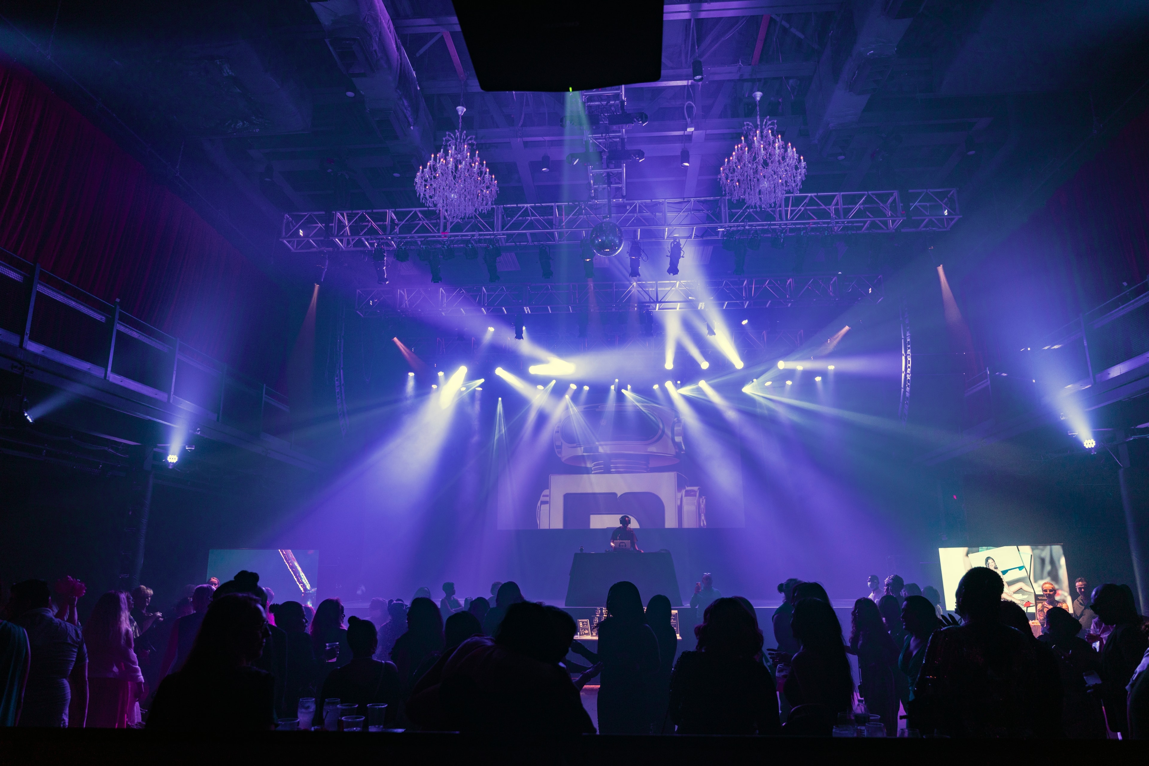 DJ performing for a nightclub event audience