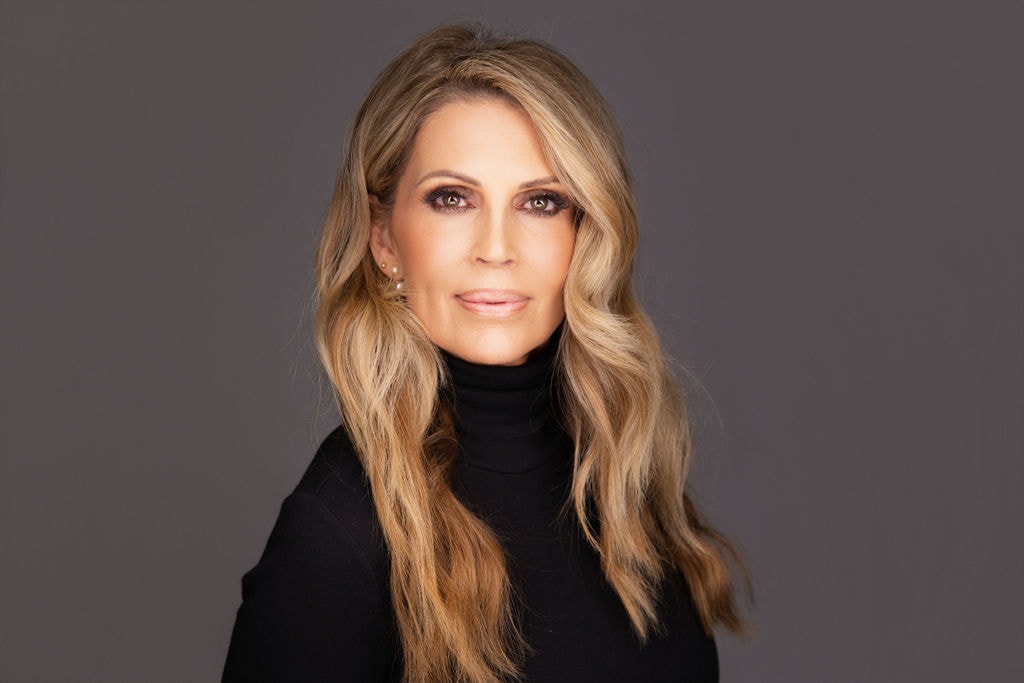 Portrait of a woman with long blonde wavy hair
