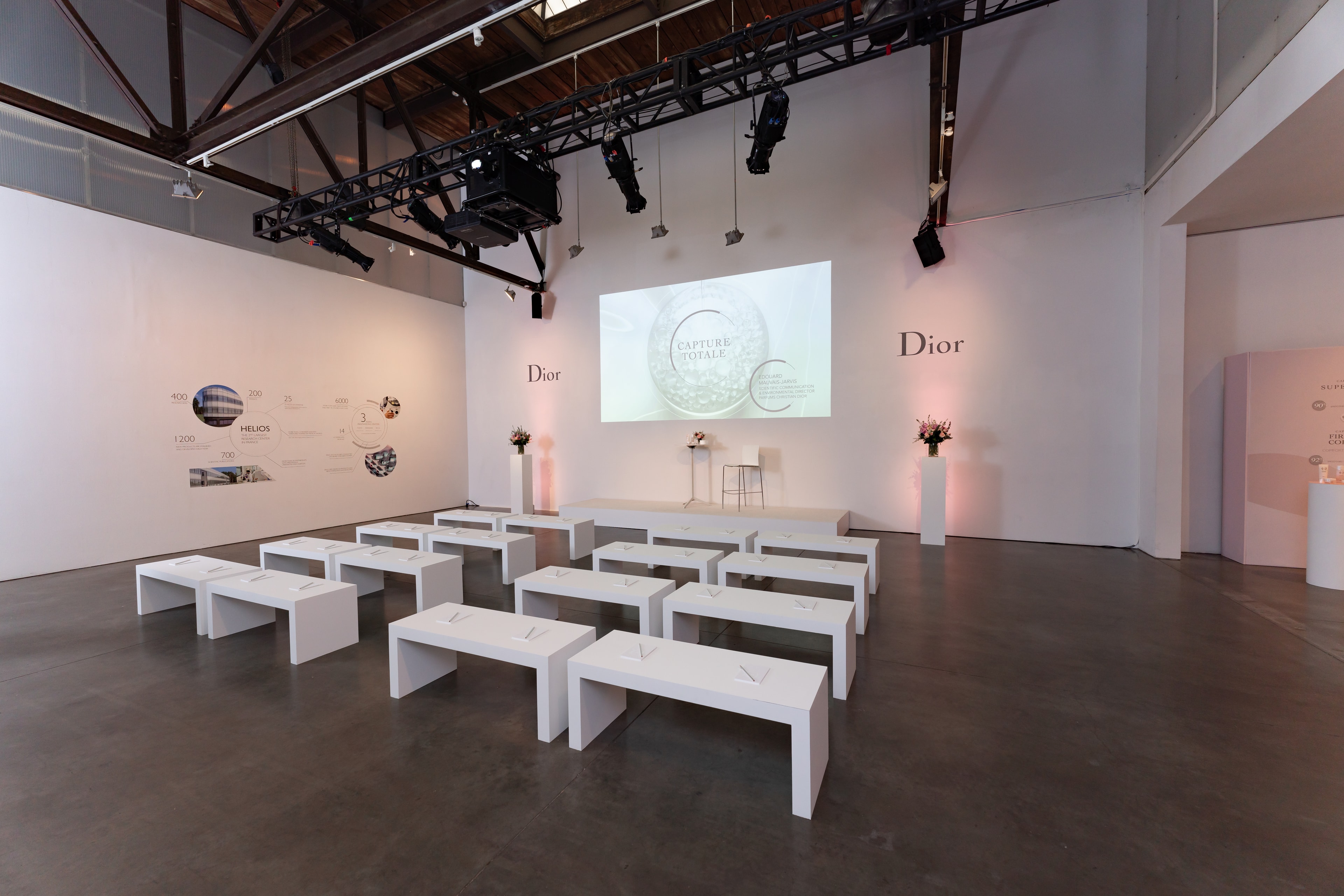 Dior beauty presentation space with white tables