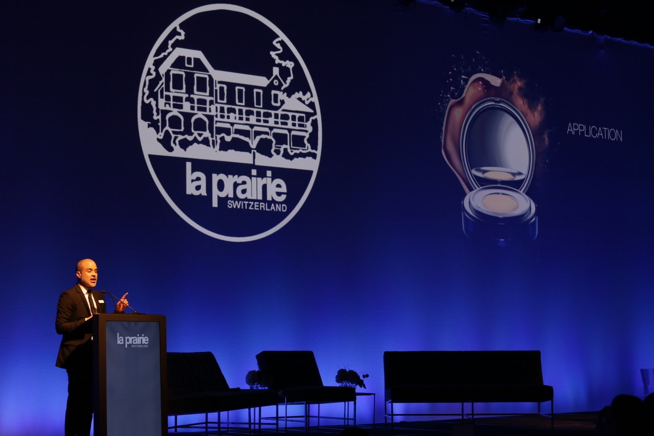 Presenter speaking at a La Prairie beauty event