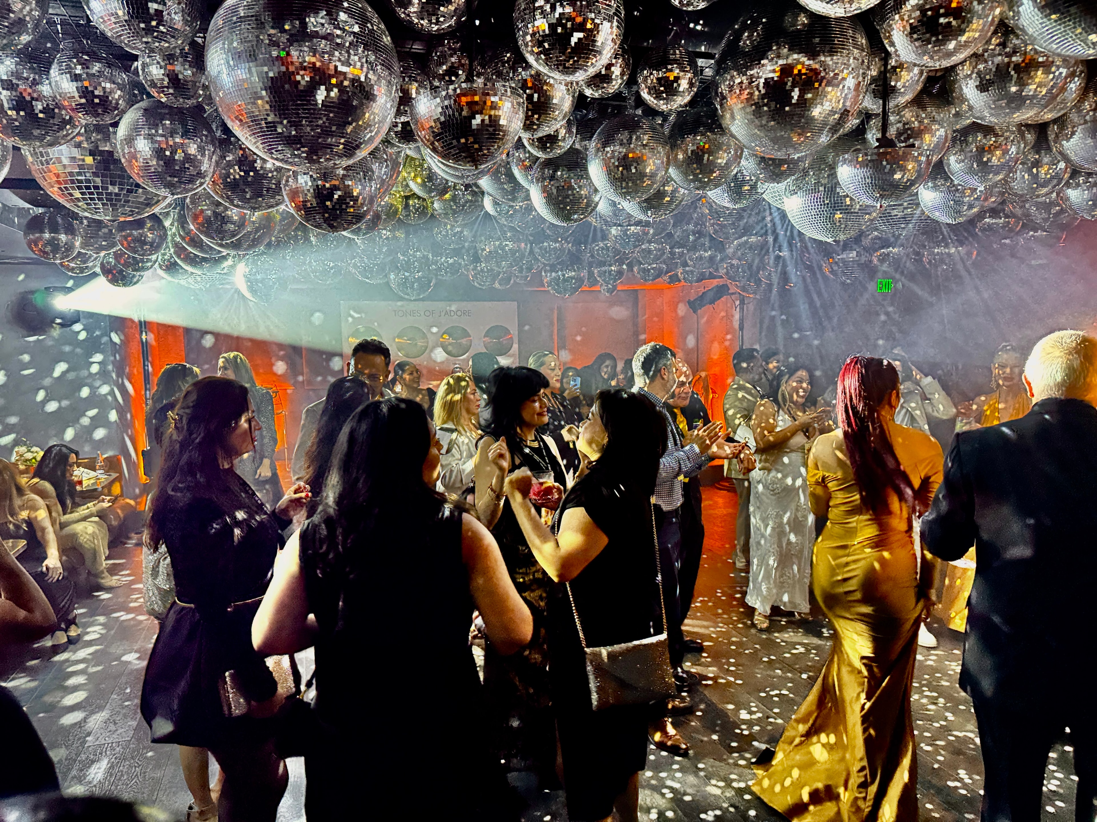 Event guests gathered beneath dramatic lighting