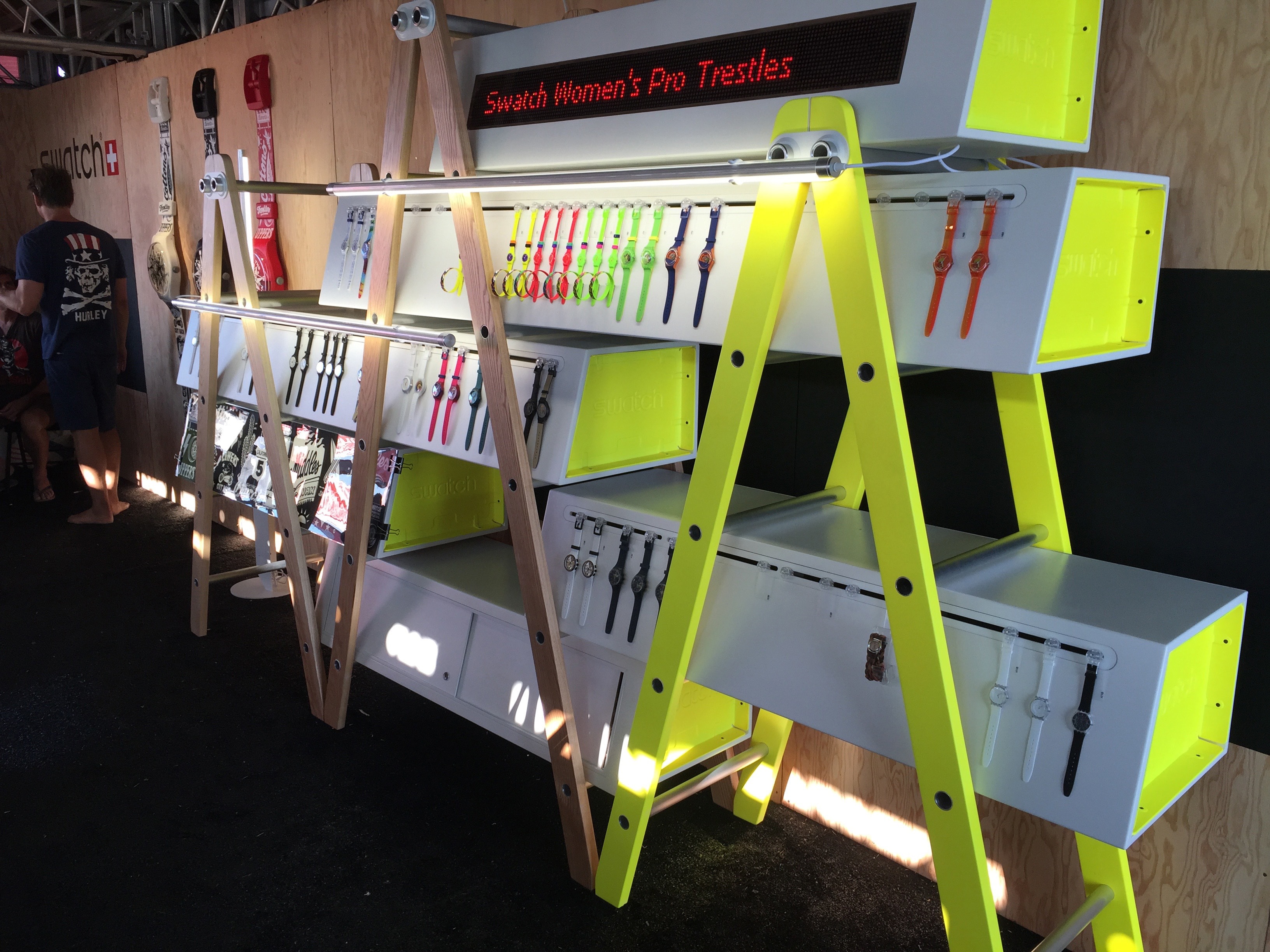 Swatch watches on colorful retail shelving