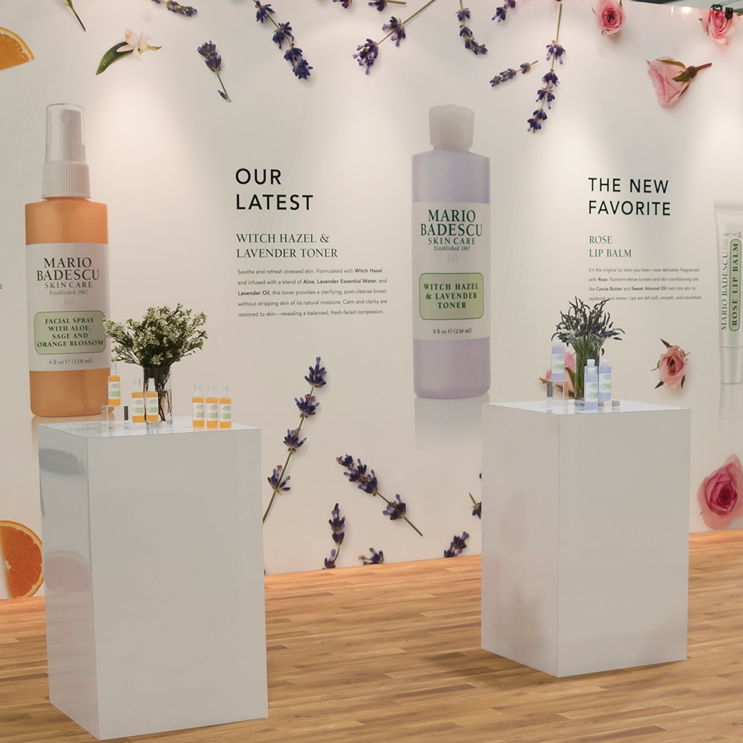Mario Badescu skincare product display with flowers