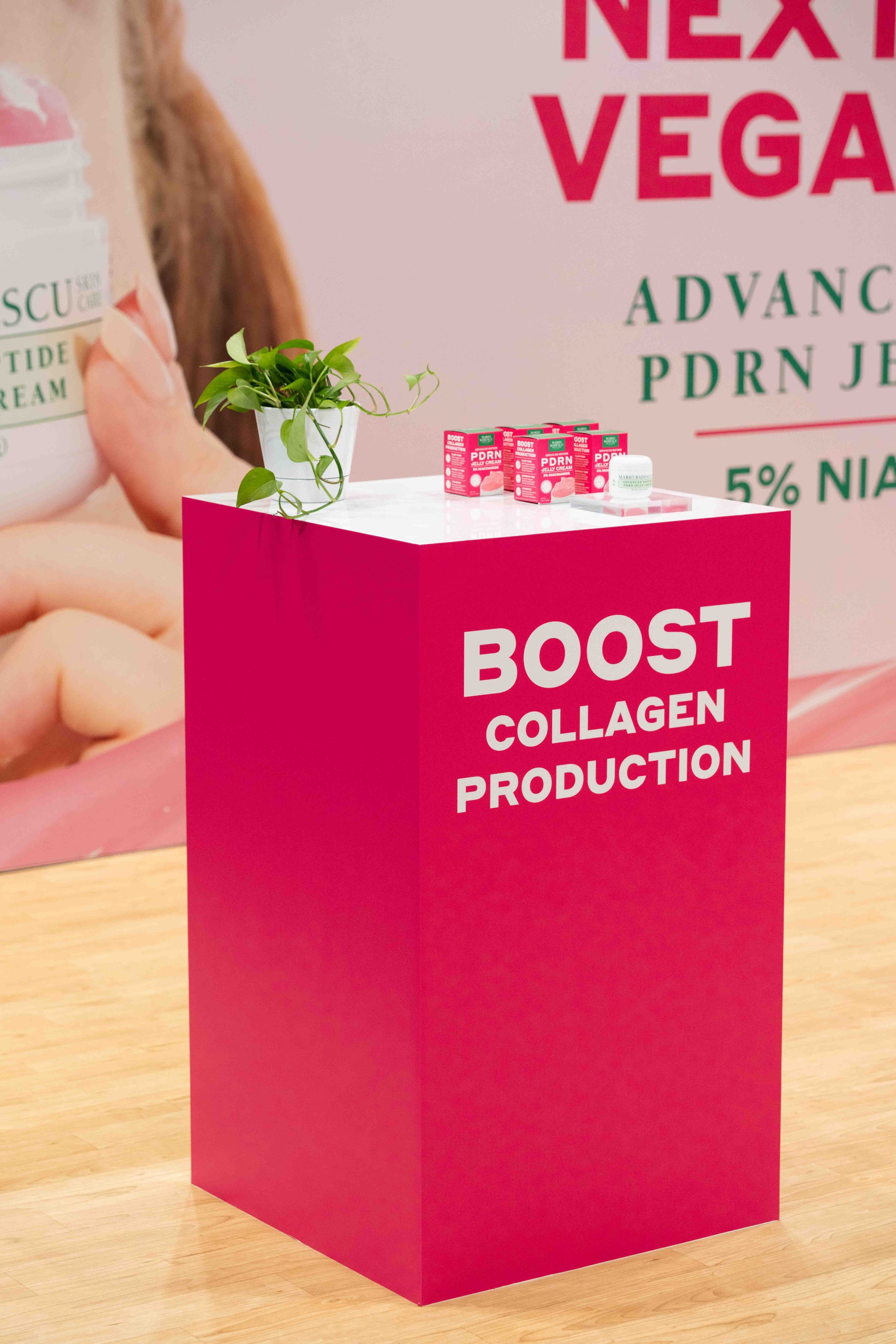 Collagen skincare product display on pink pedestal
