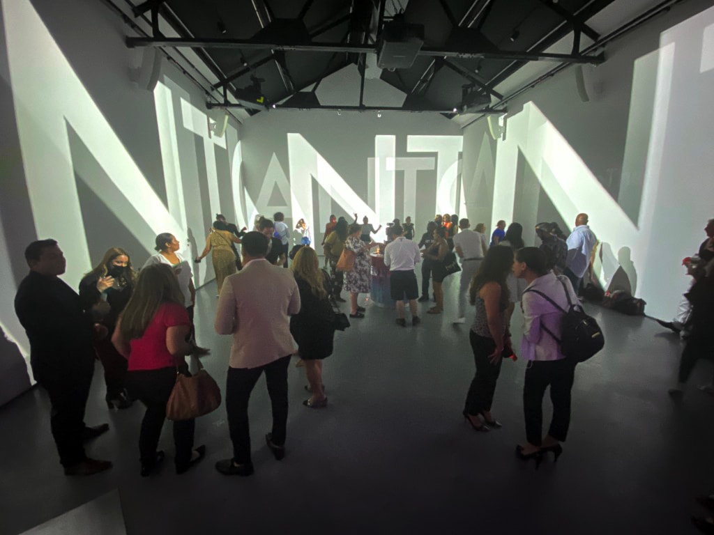 Guests viewing a projected art installation