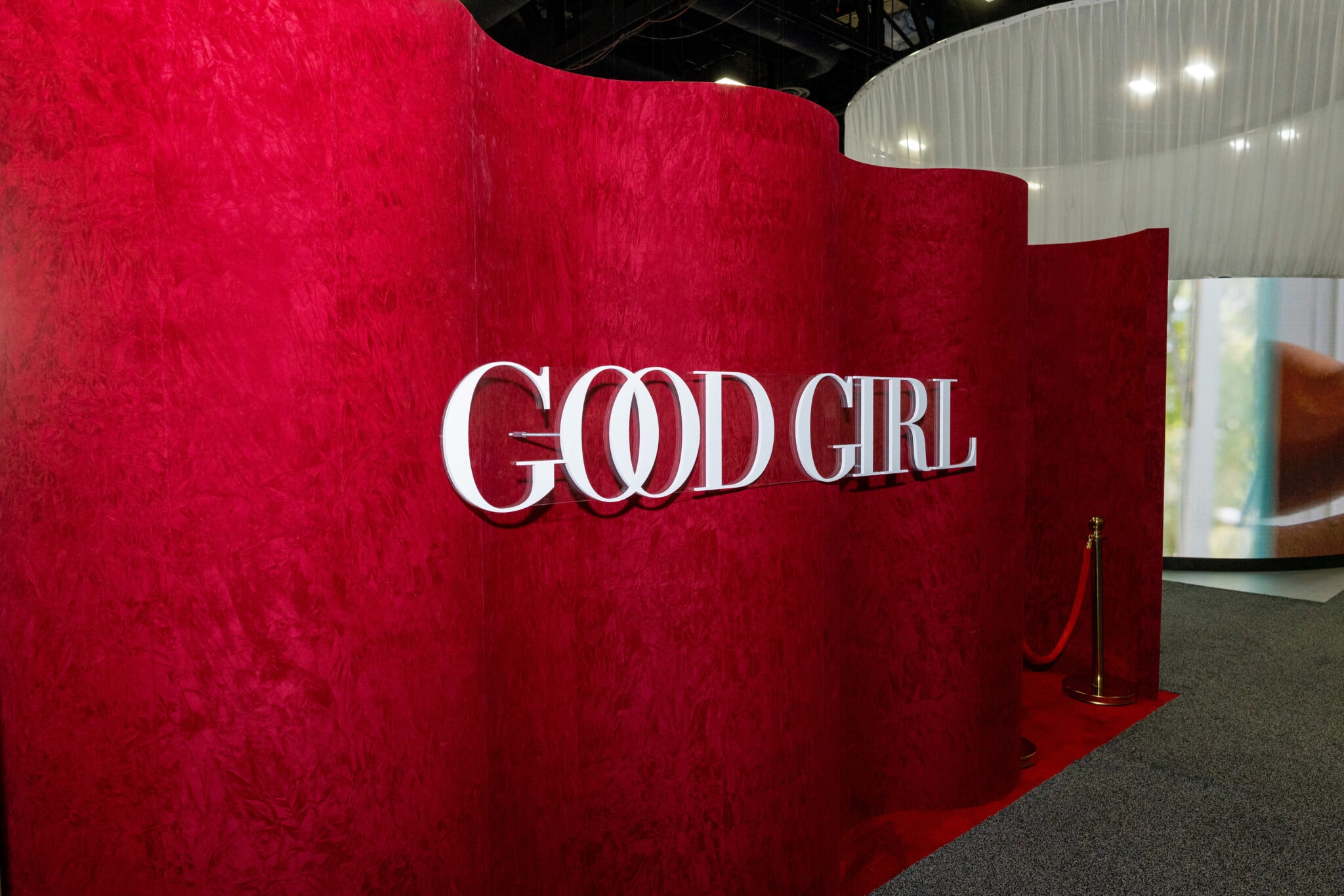 God Girl sign on red velvet backdrop
