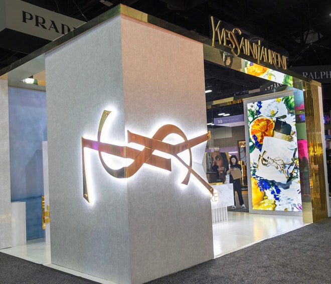 YSL cosmetics exhibition booth with illuminated logo